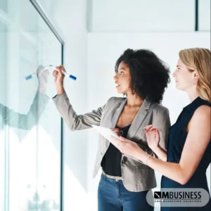 two women working on consistency board